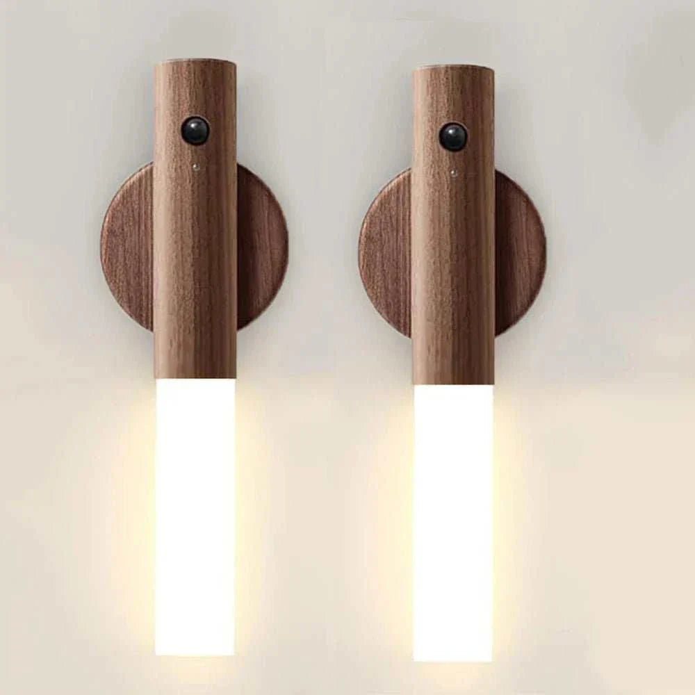Rechargeable night light with motion sensor and wooden finish, mounted on a wall.