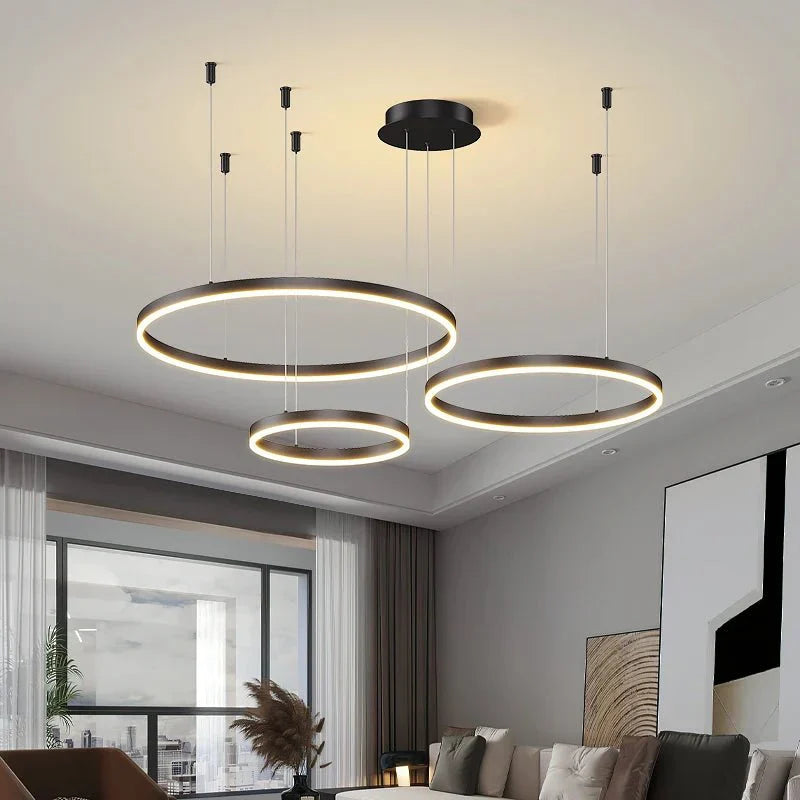 Modern BUBBLE GOLD™ LED pendant light fixture with circular design hanging from ceiling.