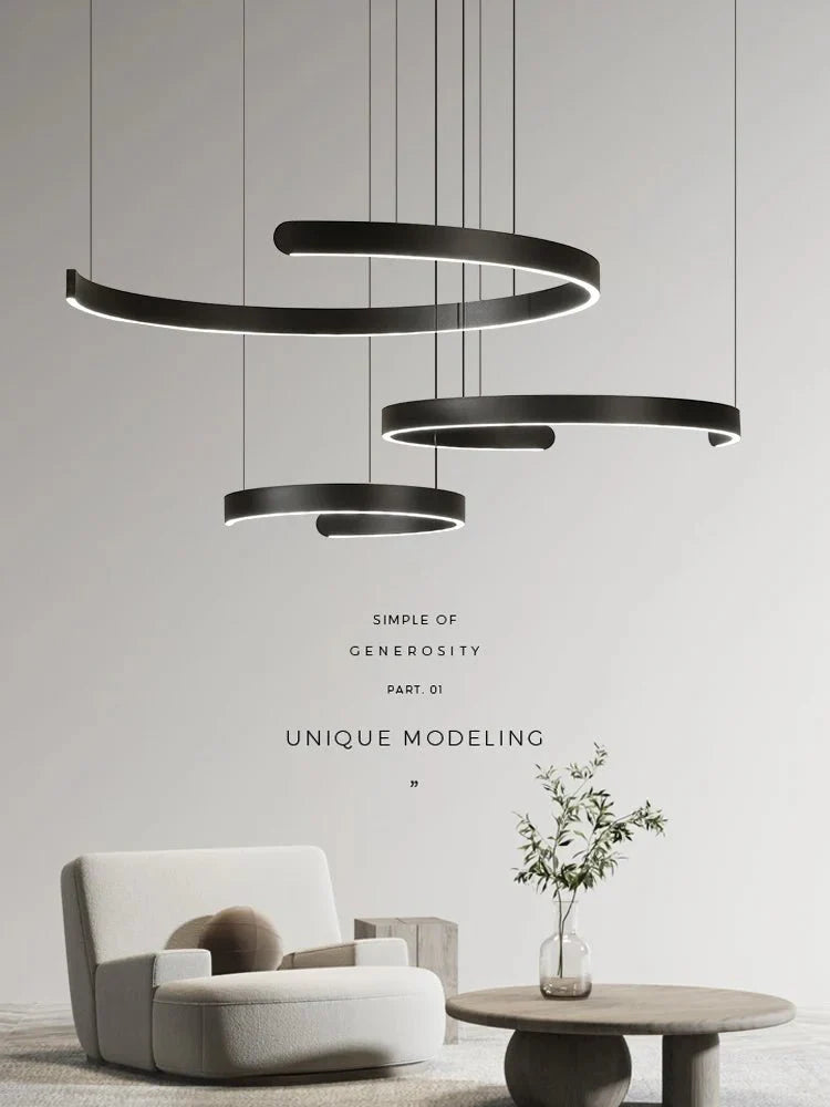 Minimalist geometric LED pendant light in modern style, featuring black and white semicircular rings, enhances ceiling aesthetics.