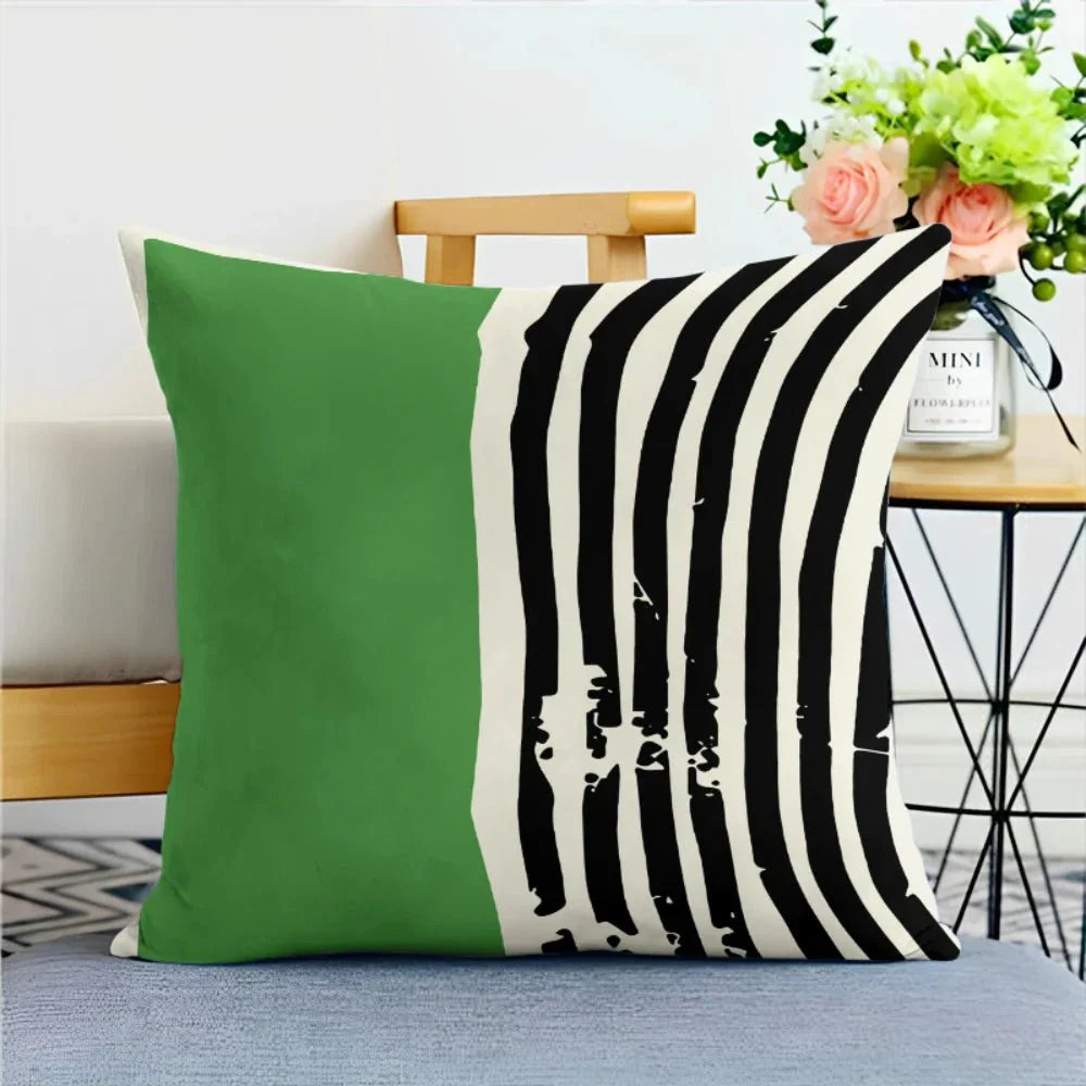 Green nature print cushion cover with abstract design, LIVIA pillowcase on couch.