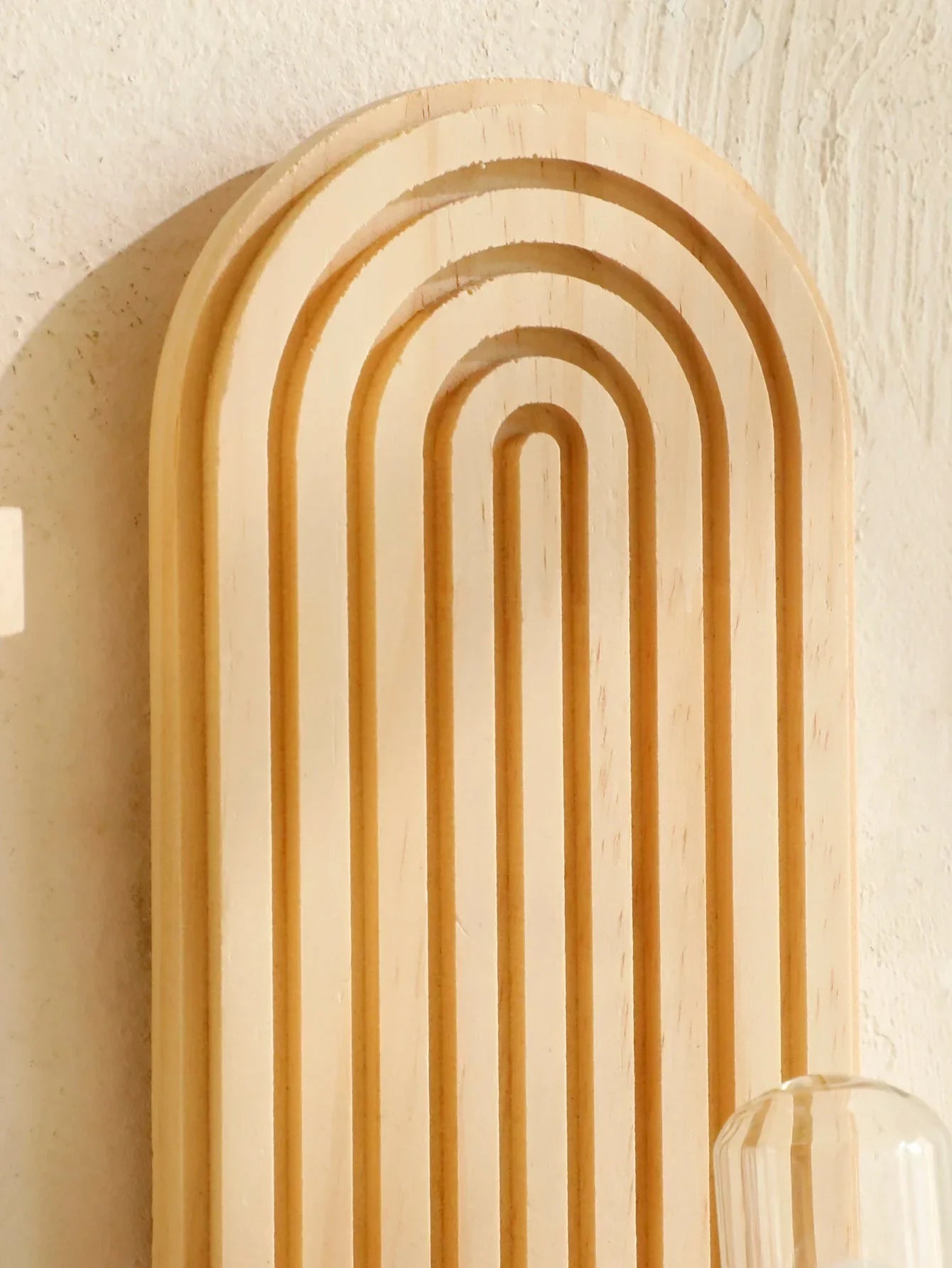 Boho style oval wooden wall shelves with natural finish for versatile home decor.