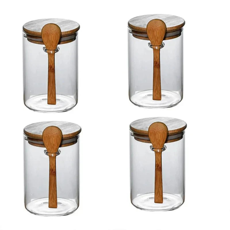 Airtight glass spice storage jars with bamboo lids and spoons.