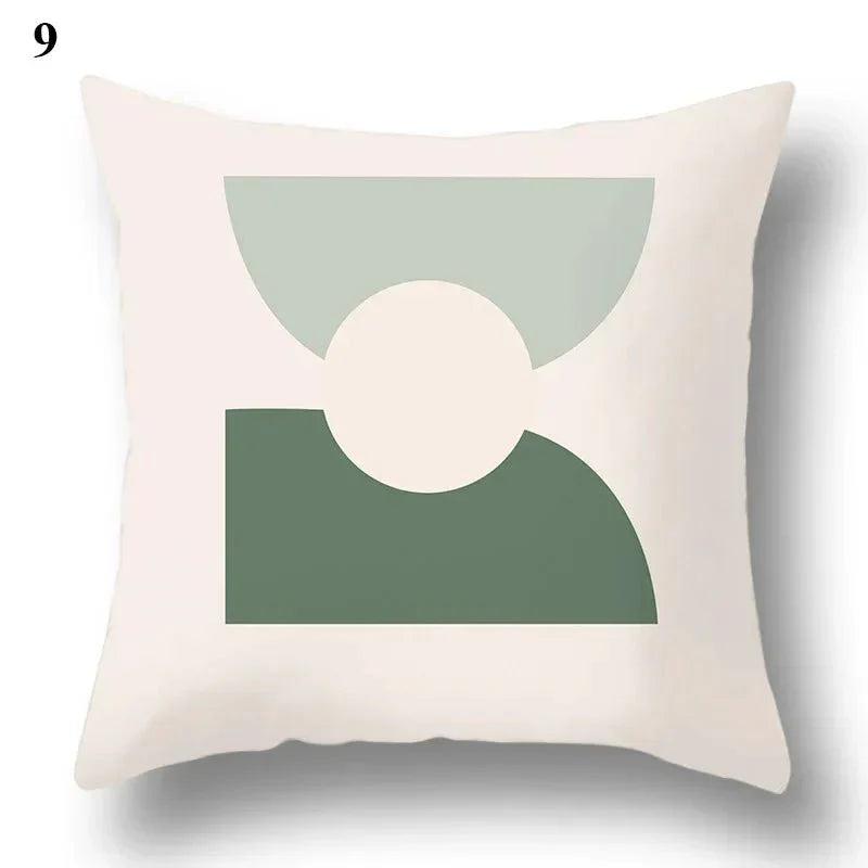 Decorative pillowcase with green leaf and abstract design on cushion cover.