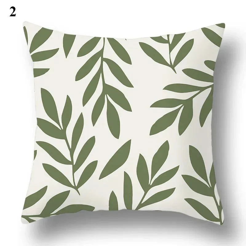 Green leaf pattern pillowcase with abstract design on a square cushion cover.