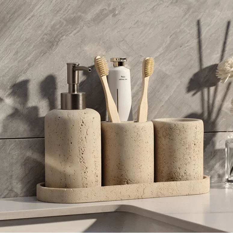 Stone effect LINCE™ bathroom organizer with toothbrush holders and pump dispenser.