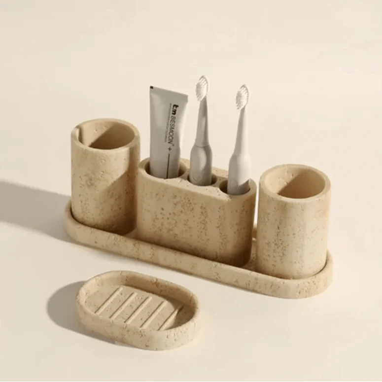 Stone effect bathroom organizer with toothbrush holders and tray.