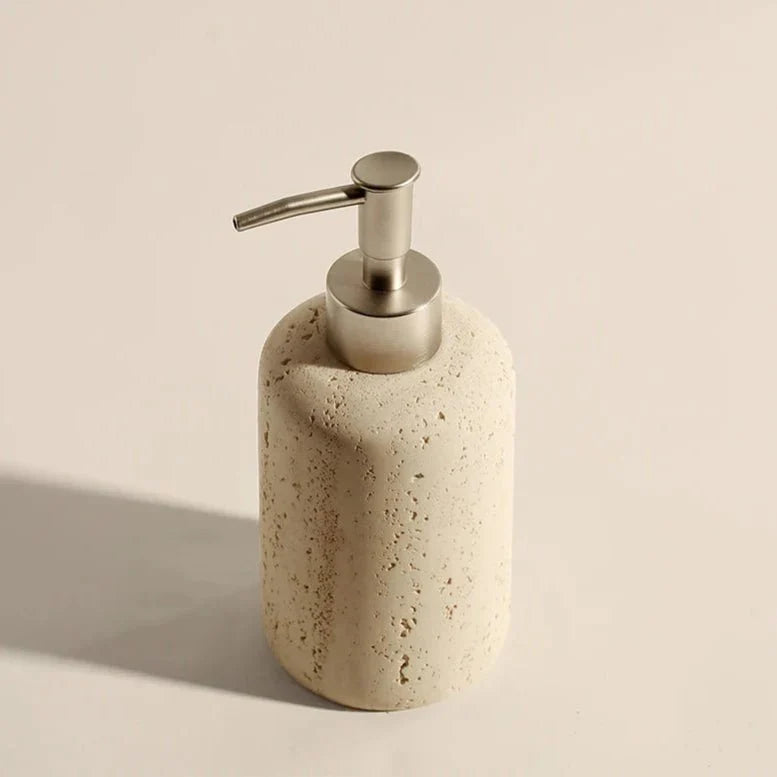 Stone-effect bathroom organizer with a dispenser, showcasing a raw, textural finish.