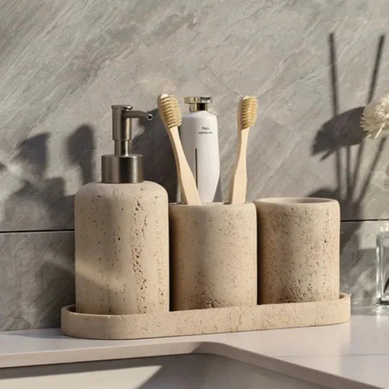 Stone effect bathroom organizer with toothbrush holders and dispenser on a countertop.