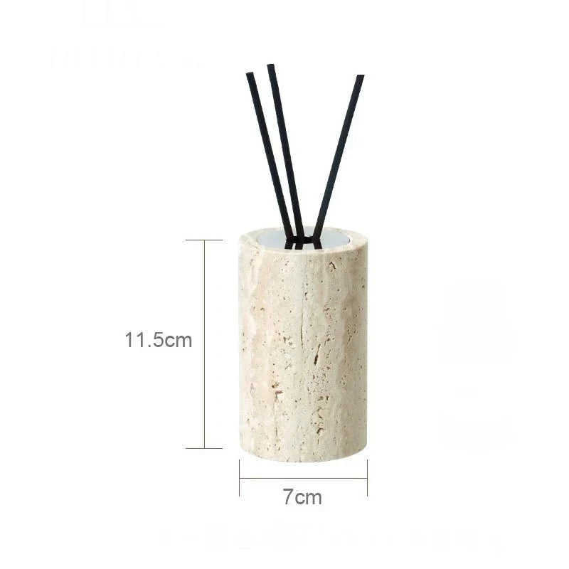 Minimalist travertine dispenser from LUX™ bathroom set with reed sticks, measuring 11.5cm by 7cm.