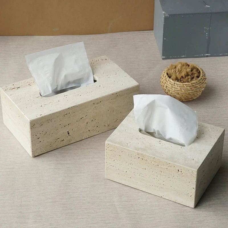 Minimalist travertine bathroom set dispenser and holder on a neutral surface.