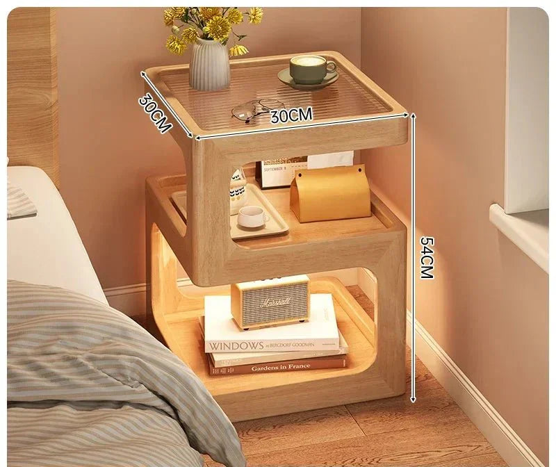 Minimalist wooden nightstand with Z-shaped design and drawer, featuring a ventilated top and ambient LED lighting.