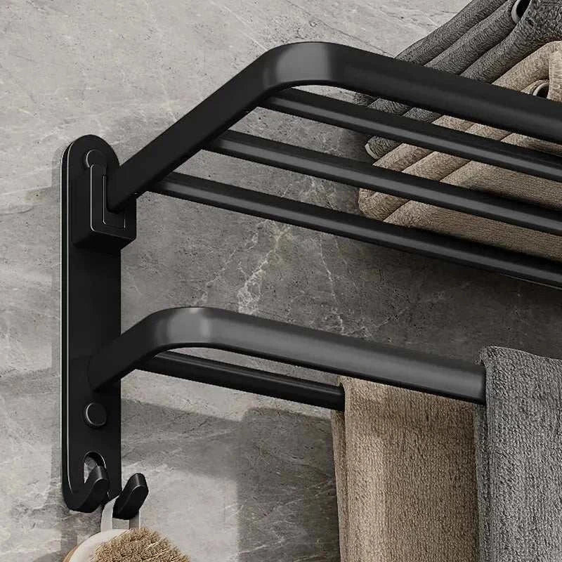 Wall-mounted matte black towel rack with industrial iron design, featuring upper shelf and hanging bar for modern bathrooms.