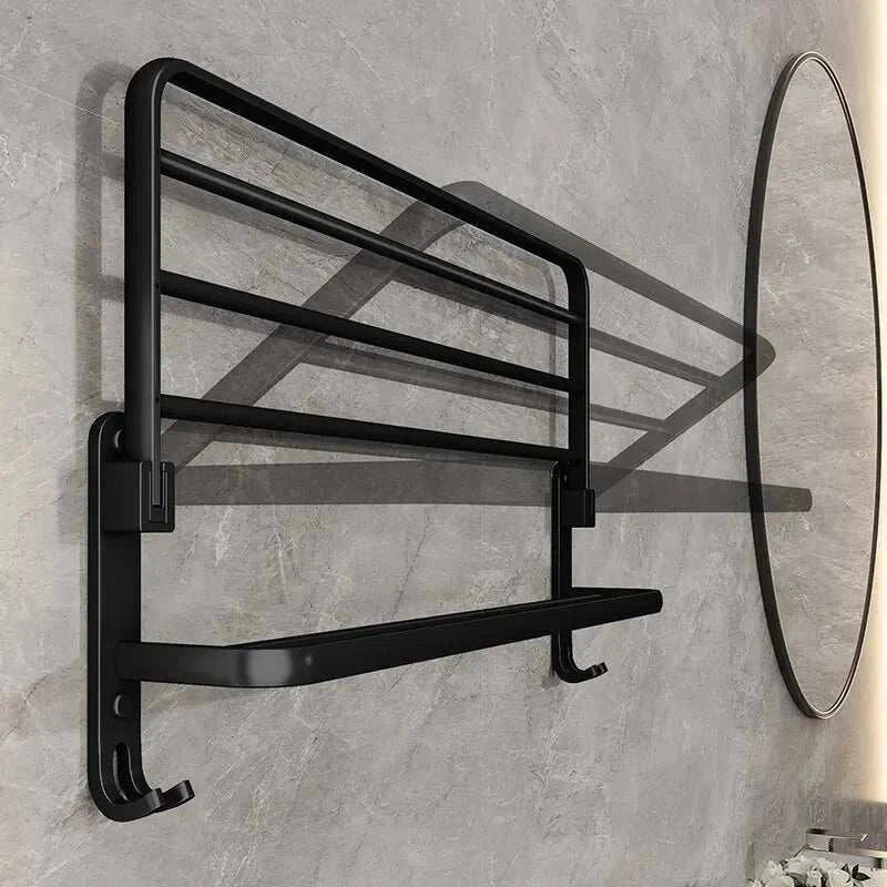 Wall-mounted black industrial towel rack with upper shelf and hanging bar.