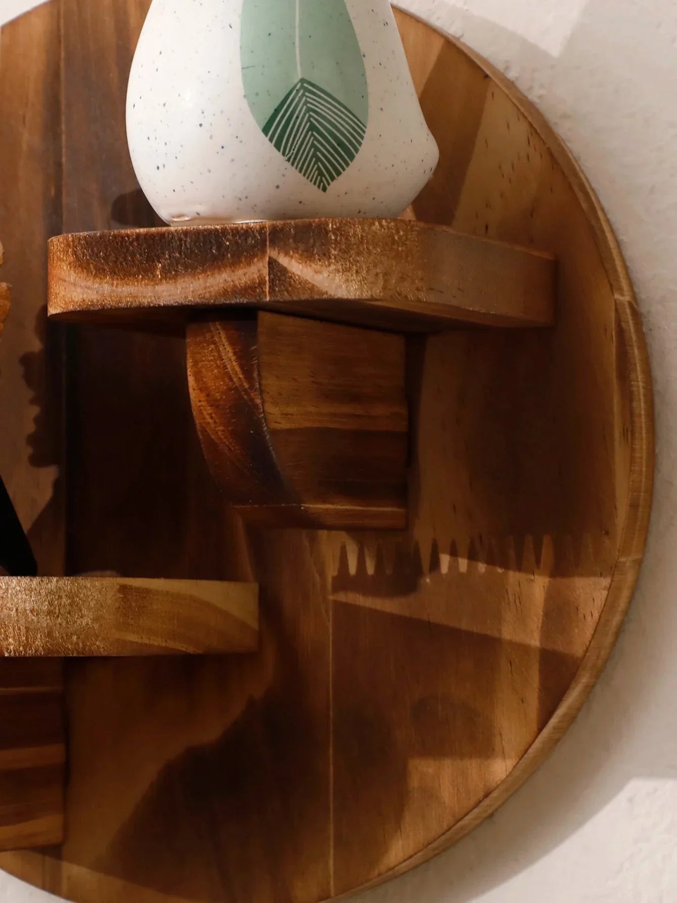 Oval floating wood wall shelf displaying a decorative vase, part of the MOONALUNA™ collection.