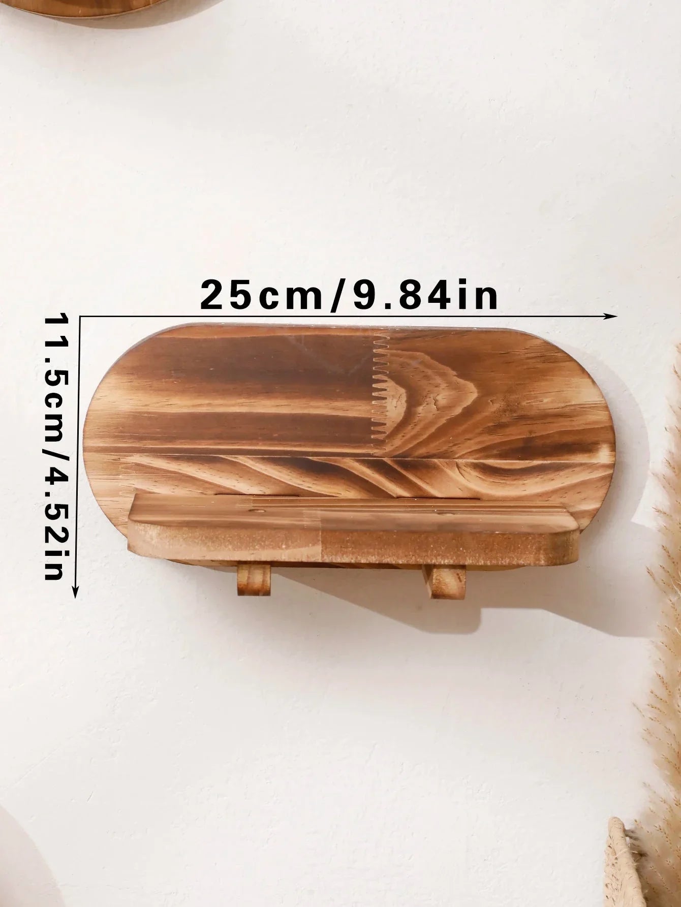 Oval floating wall shelf in natural wood with dimensions 25cm x 11.5cm.