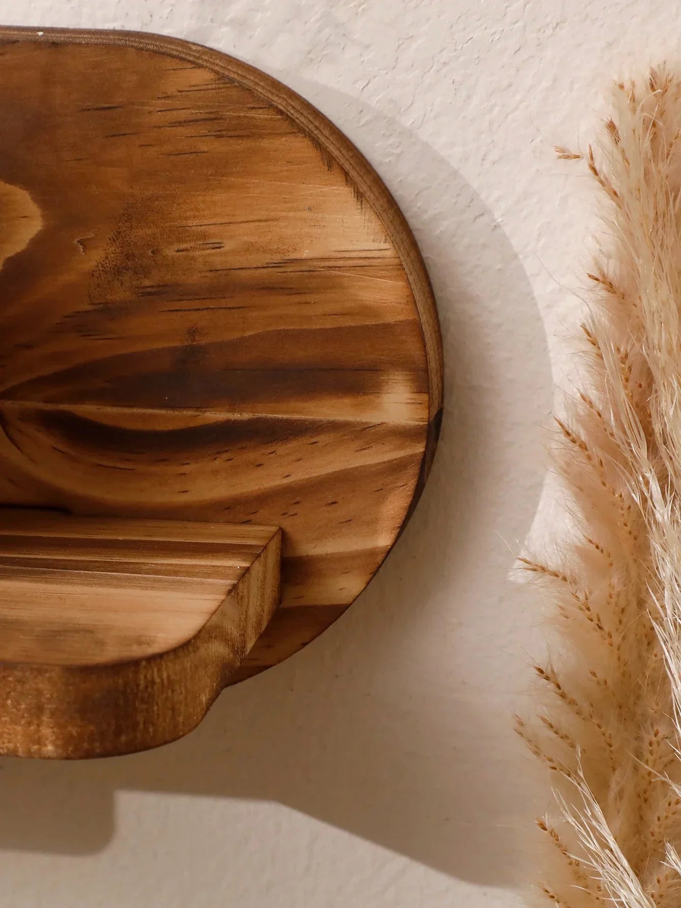 Oval floating wood shelf by MOONALUNA™ with natural grain pattern, ideal for wall decor.