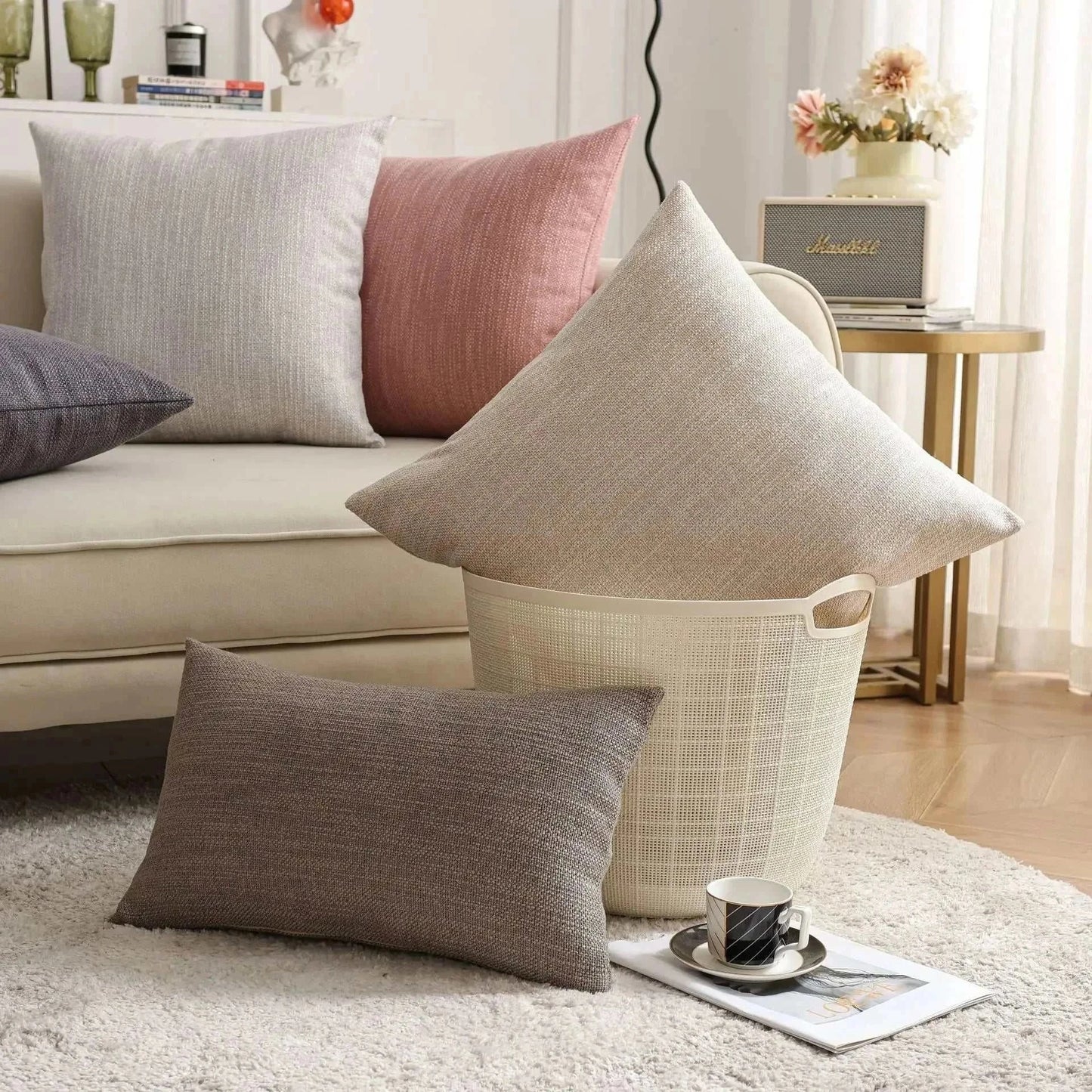 Natural linen throw pillow covers on a sofa with a cozy, modern interior setting.