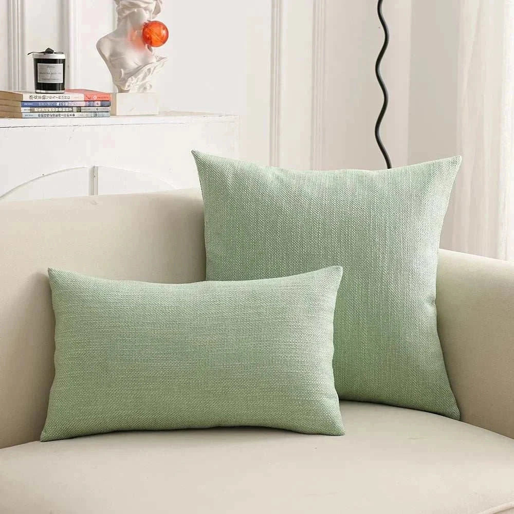 Natural linen throw pillow covers on sofa, showcasing textured and earthy tones.