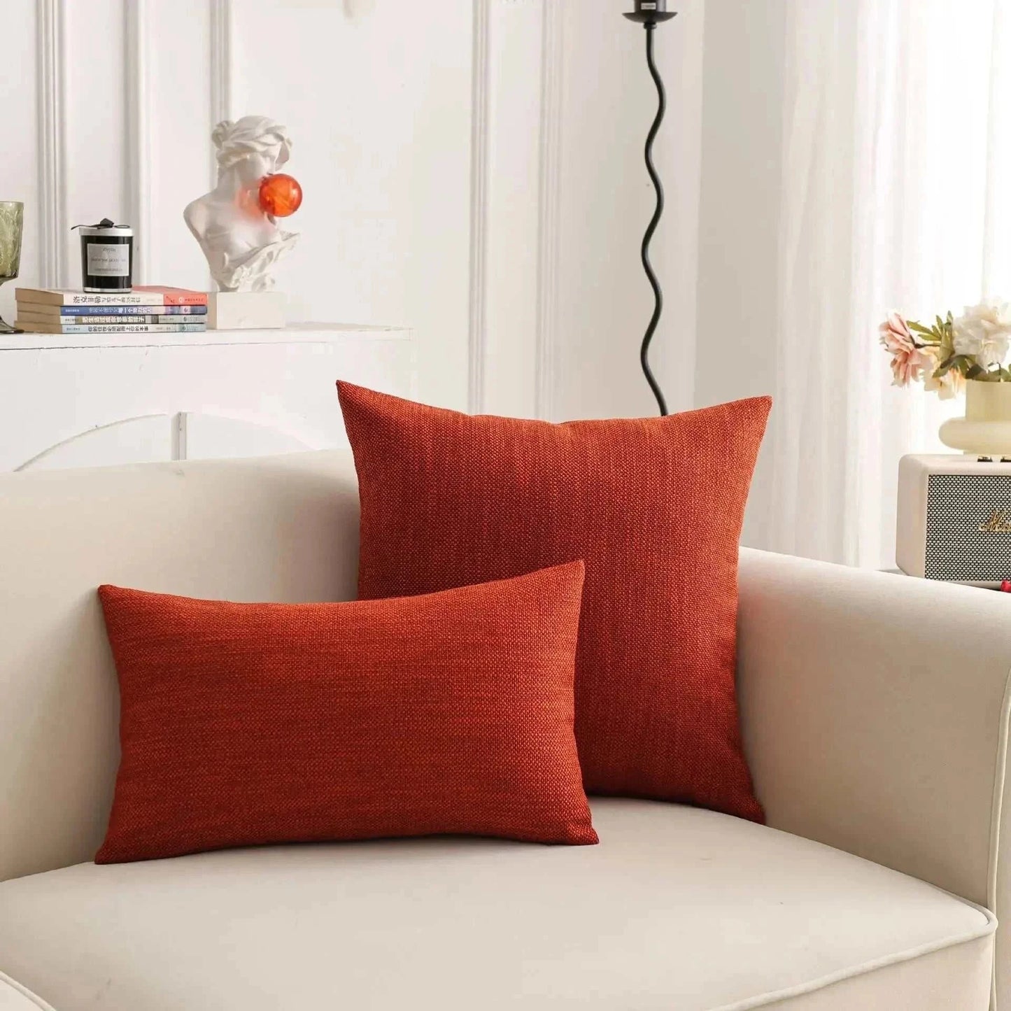 Natural linen throw pillow cover on sofa, showcasing earthy tones and textured design.