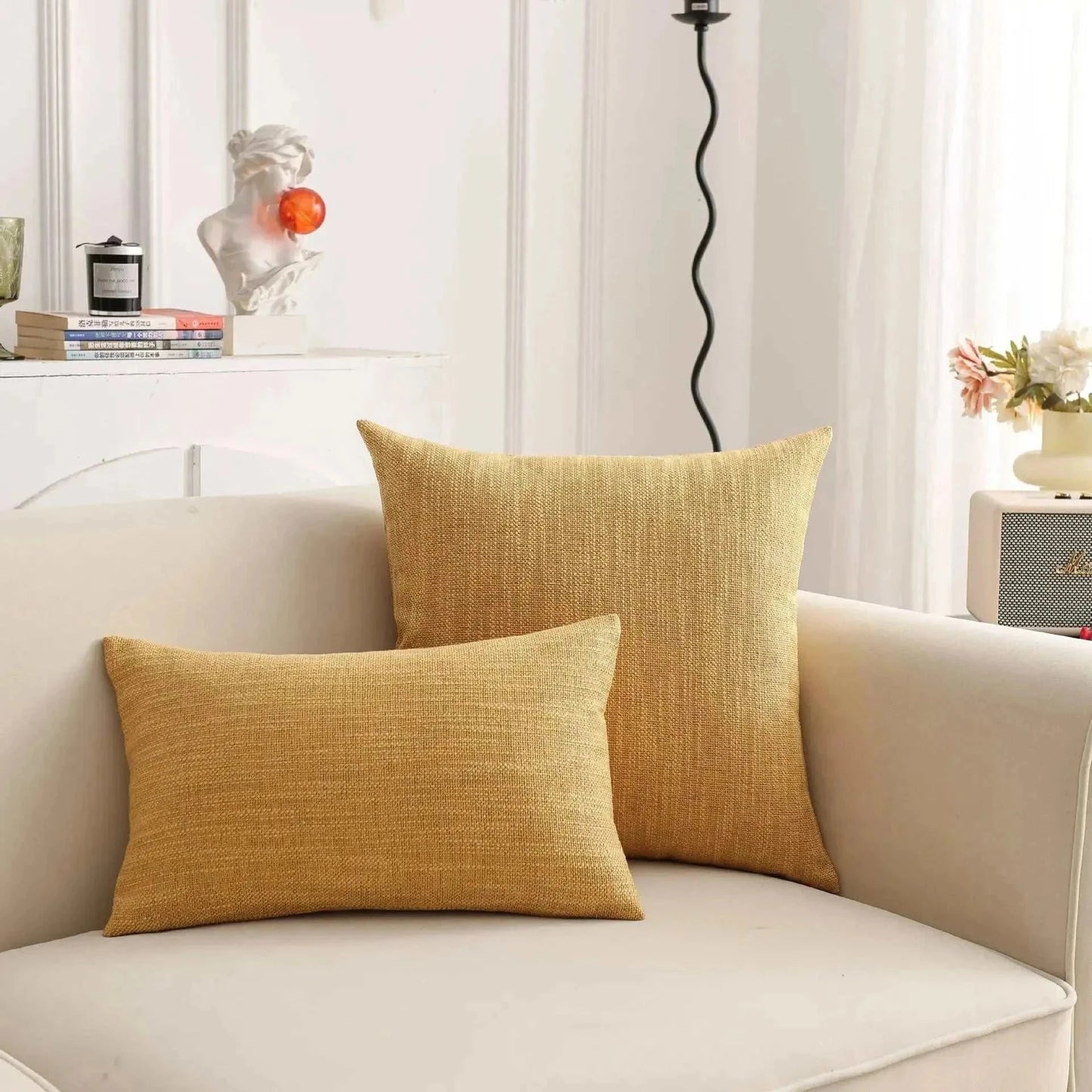 Natural linen throw pillow covers on a sofa, showcasing textured, earthy tones for a calm interior.