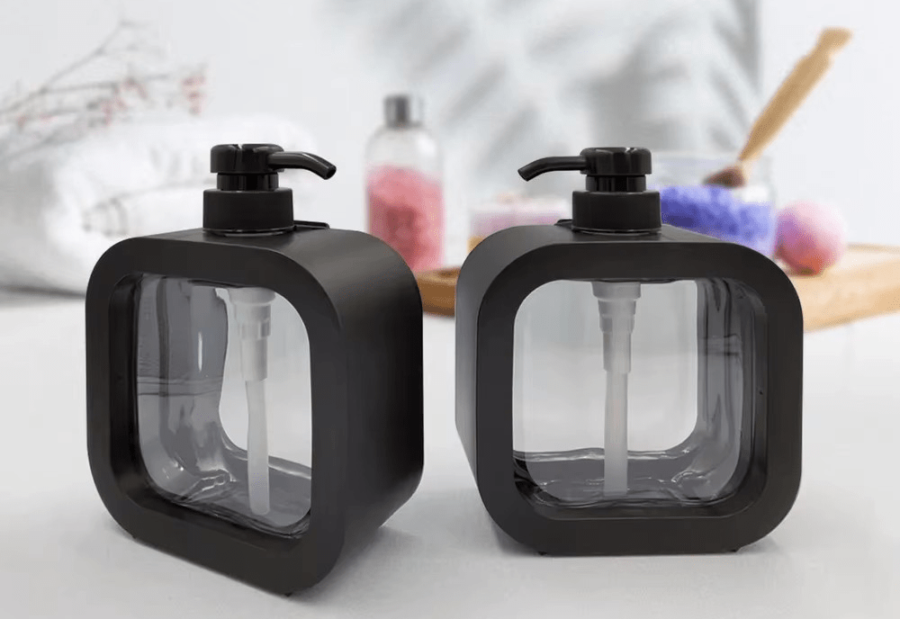 Modern matte black soap dispensers set on a countertop with a contemporary design, ideal for kitchen and bathroom use.