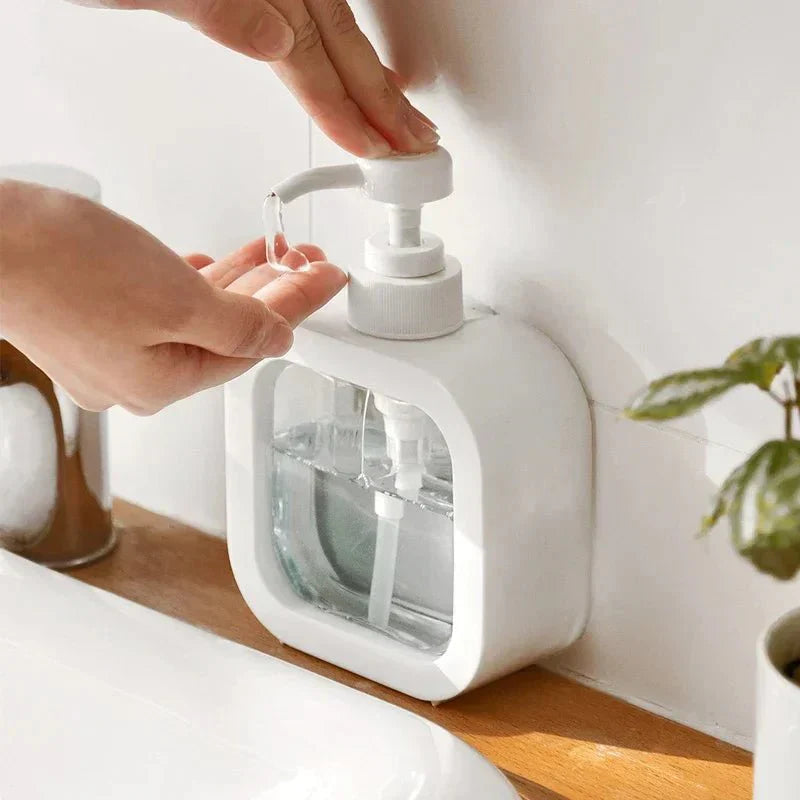Modern matte ACQUO™ soap dispenser on countertop in use.