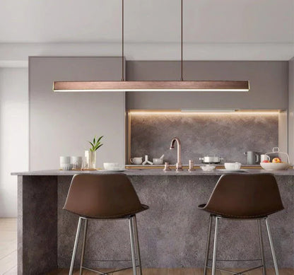 Minimalist pendant LED light illuminating a modern kitchen.