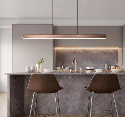 Minimalist pendant LED light illuminating a modern kitchen.