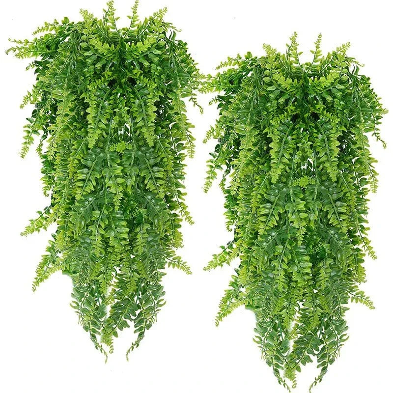 Lush hanging faux fern greenery for indoor decoration.