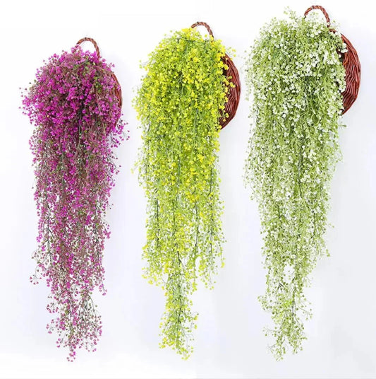 Colorful artificial hanging vine in purple, yellow, and green.