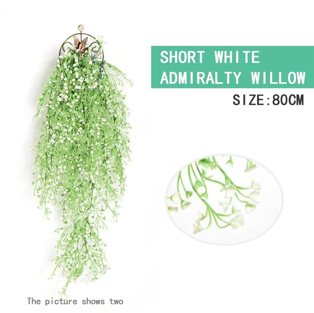 Hanging faux vine in soft green with white accents, 80cm long, flexible and vibrant for decorative use.