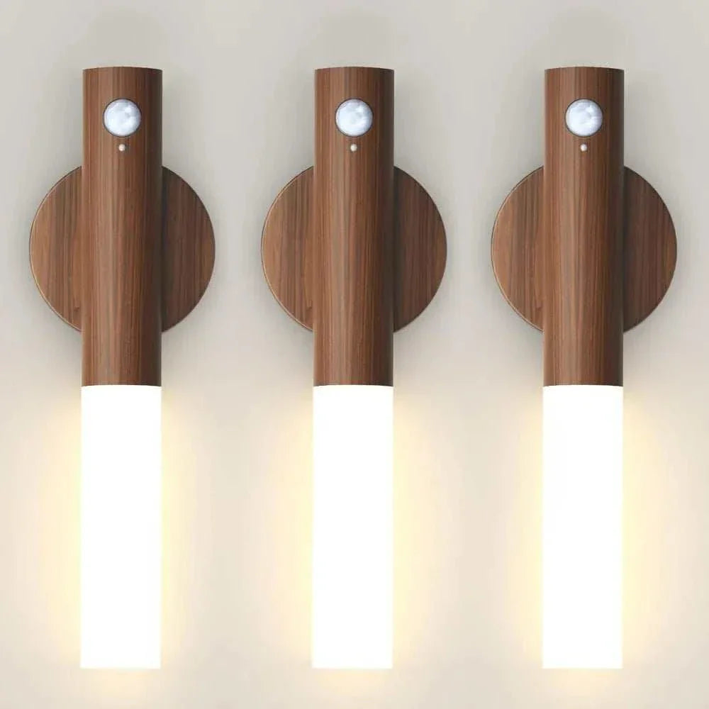 Rechargeable motion sensor night light with wood finish and LED illumination.