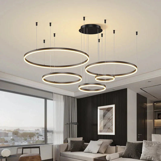 Modern LED pendant light fixture with circular design in a stylish living room.