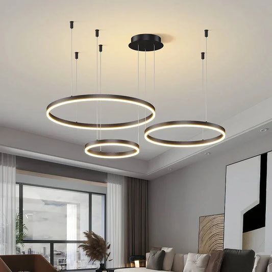 Modern BUBBLE GOLD™ LED pendant light fixture with circular design hanging from ceiling.