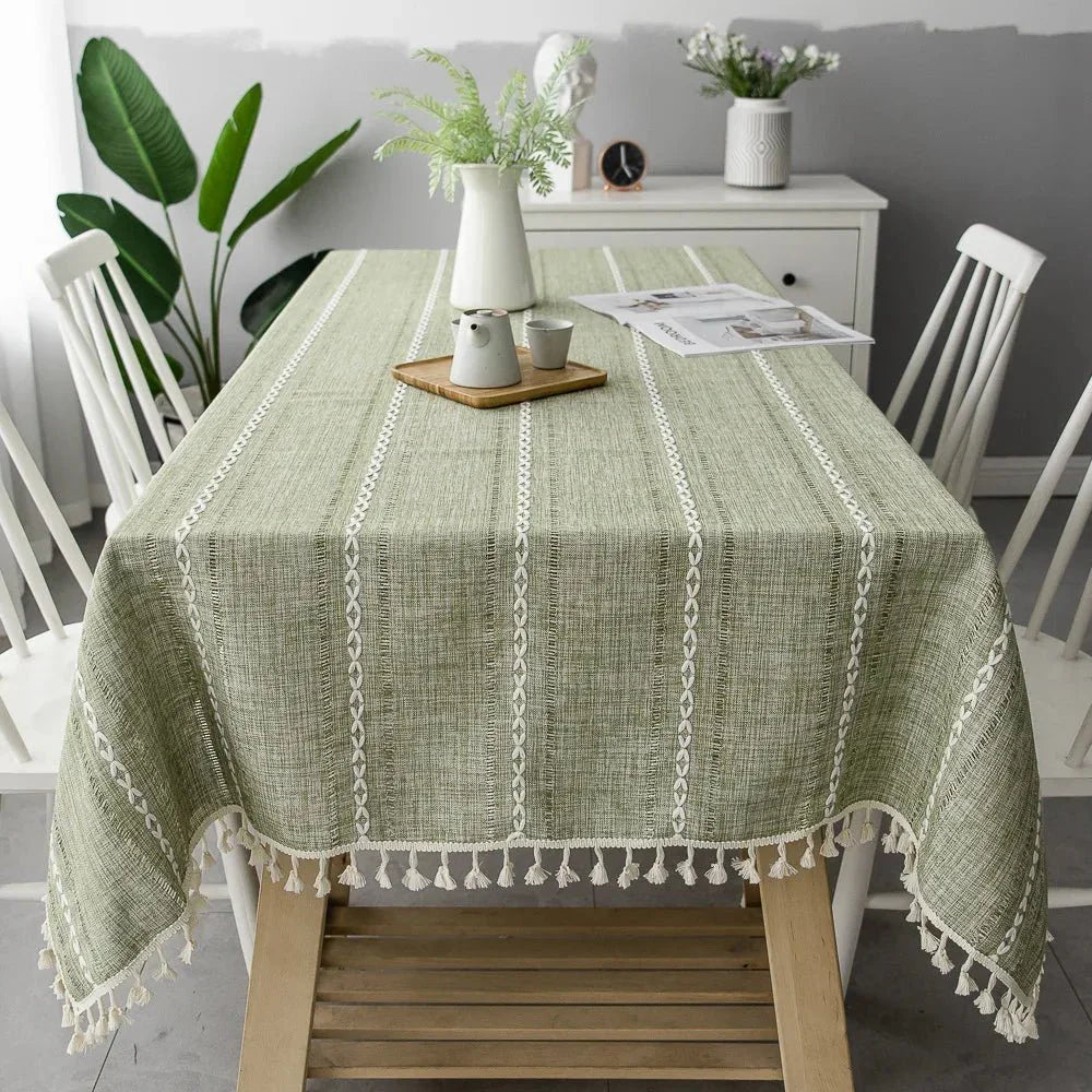 Soft linen-feel CENTRARIN™ tablecloth with woven pattern and tassel edge on a dining table.