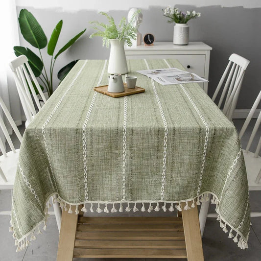 Soft linen-feel CENTRARIN™ tablecloth with woven pattern and tassel edge on a dining table.