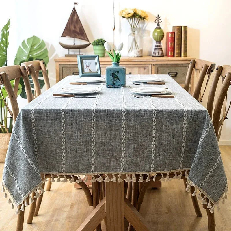 Soft linen-feel tablecloth with tassel edges, enhancing table decor for everyday use.