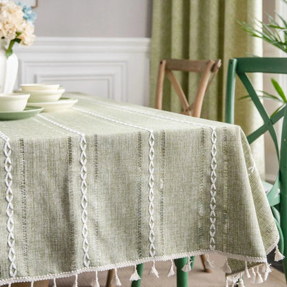 Soft linen-feel tablecloth with woven pattern and tassel edge, suitable for everyday use.