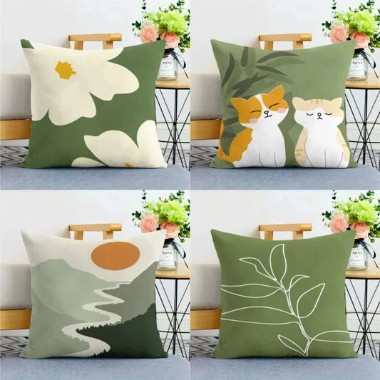 Green nature print cushion covers with flowers, cats, and abstract designs, featuring sage green tones.