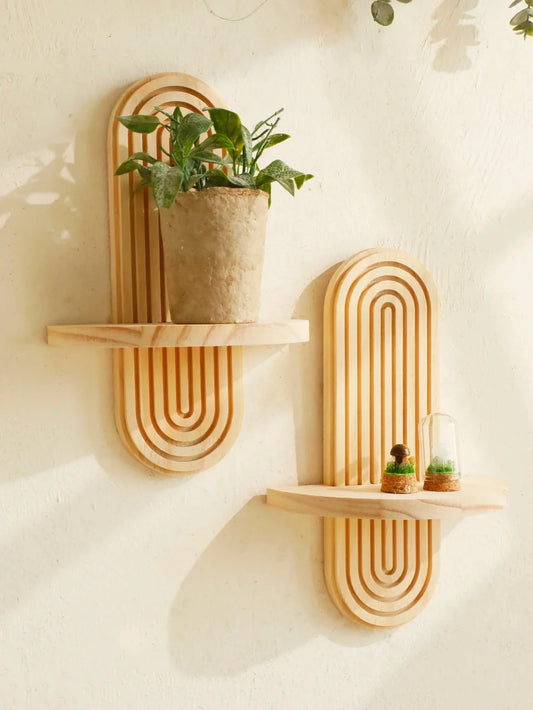 Wooden boho style oval wall shelves with geometric design displaying plants and decor.