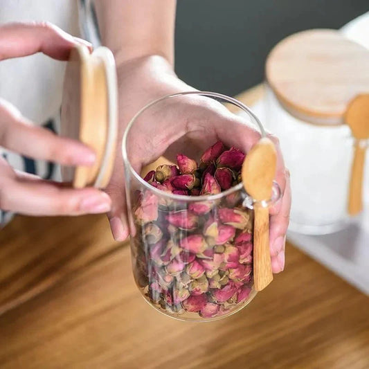 Airtight glass spice jar with bamboo lid and spoon for efficient spice storage.