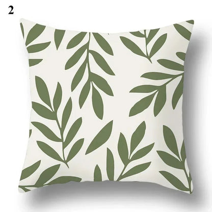 Green leaf pattern pillowcase with abstract design on a square cushion cover.