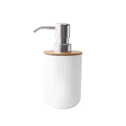 Minimalist bamboo bathroom dispenser with matte ceramic and chrome pump.