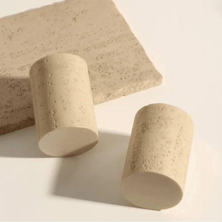 Stone effect bathroom organizer set with textured cylindrical holders on a matching tray.