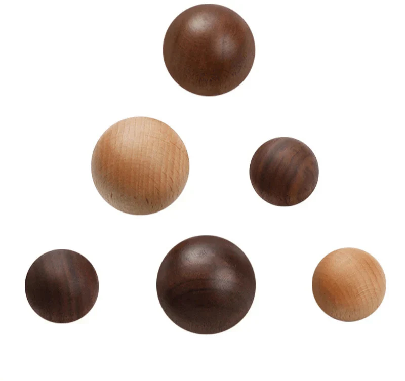 Natural wood knobs in various sizes and tones, ideal for furniture and cabinet pulls.