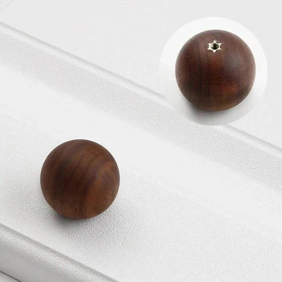 Minimalist natural wood knob for drawers and cabinets.