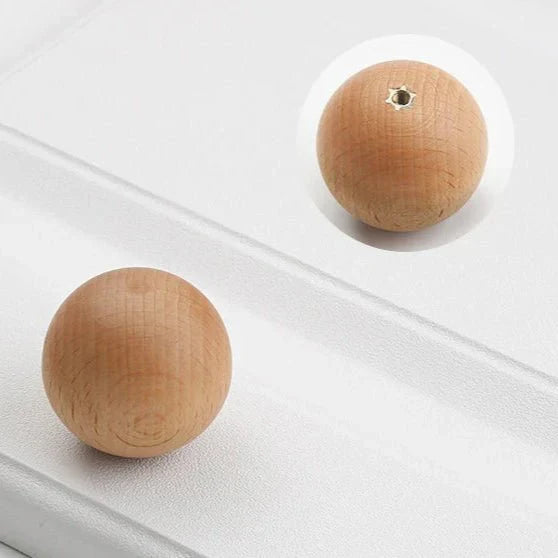 Minimalist wood knob made from natural beech or walnut, ideal for cabinets and drawers.