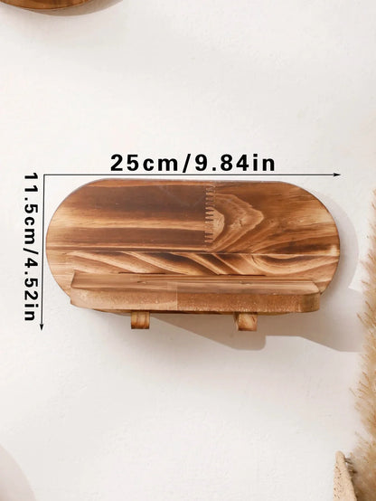Oval floating wall shelf in natural wood with dimensions 25cm x 11.5cm.