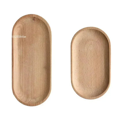 Oval wood serving tray set by KUSARE™ in natural finish.