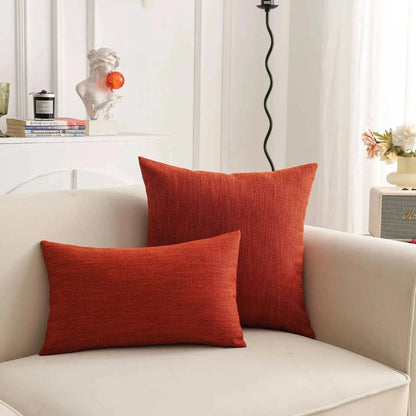 Natural linen throw pillow cover on sofa, showcasing earthy tones and textured design.